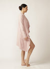 Side view of model wearing pink lounge cardi with matching nursing cami and brief