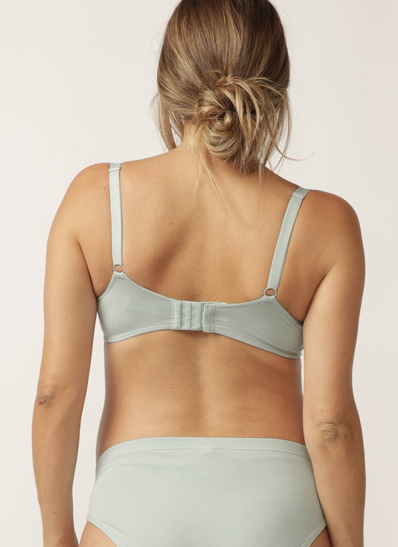 Back view of pregnant model wearing sage green nursing bra with matching briefs