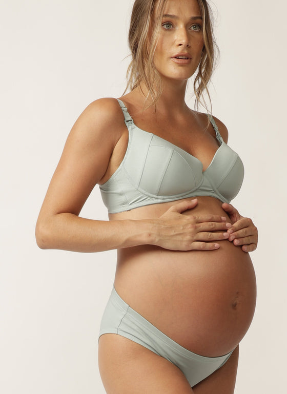  Pregnant model wearing sage green nursing bra with matching briefs