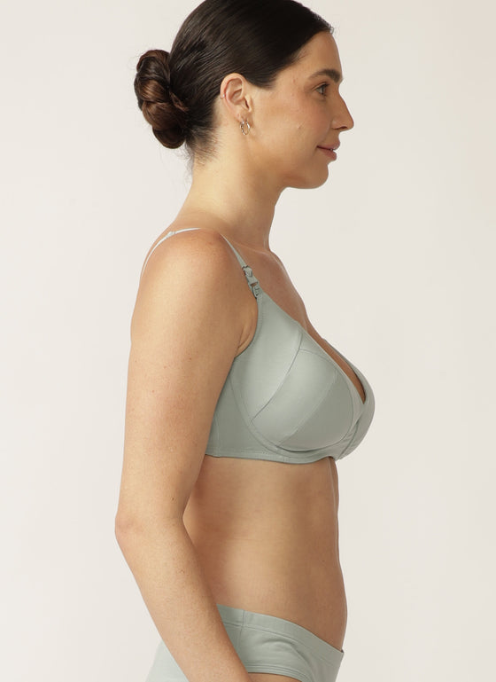 Side view of model wearing sage green nursing bra with matching briefs