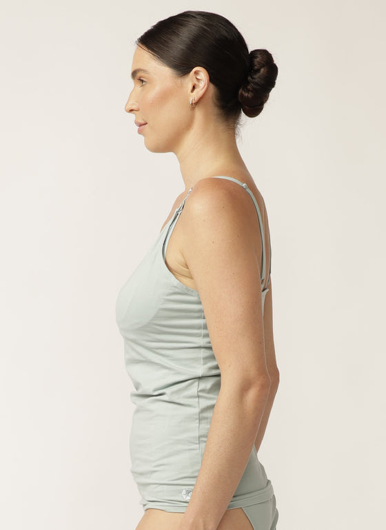  Side view of model wearing sage green nursing camisole with matching briefs