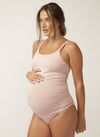 Pregnant model wearing pink nursing camisole with matching briefs
